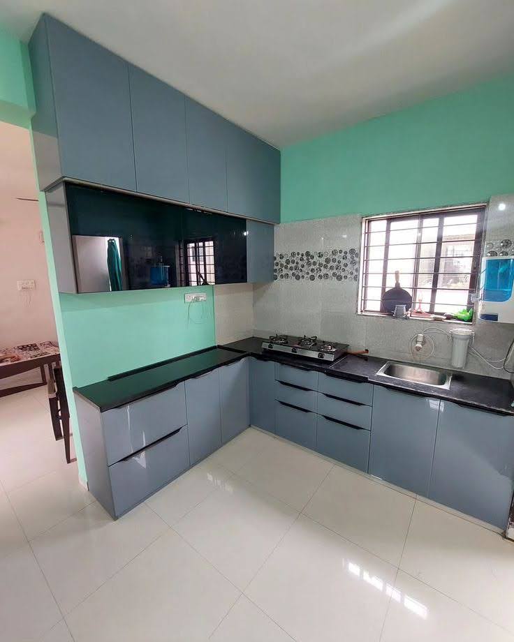 Modern L-Shaped Modular Kitchen with Quartz Countertop & Glass Overhead Cabinets - Execution #